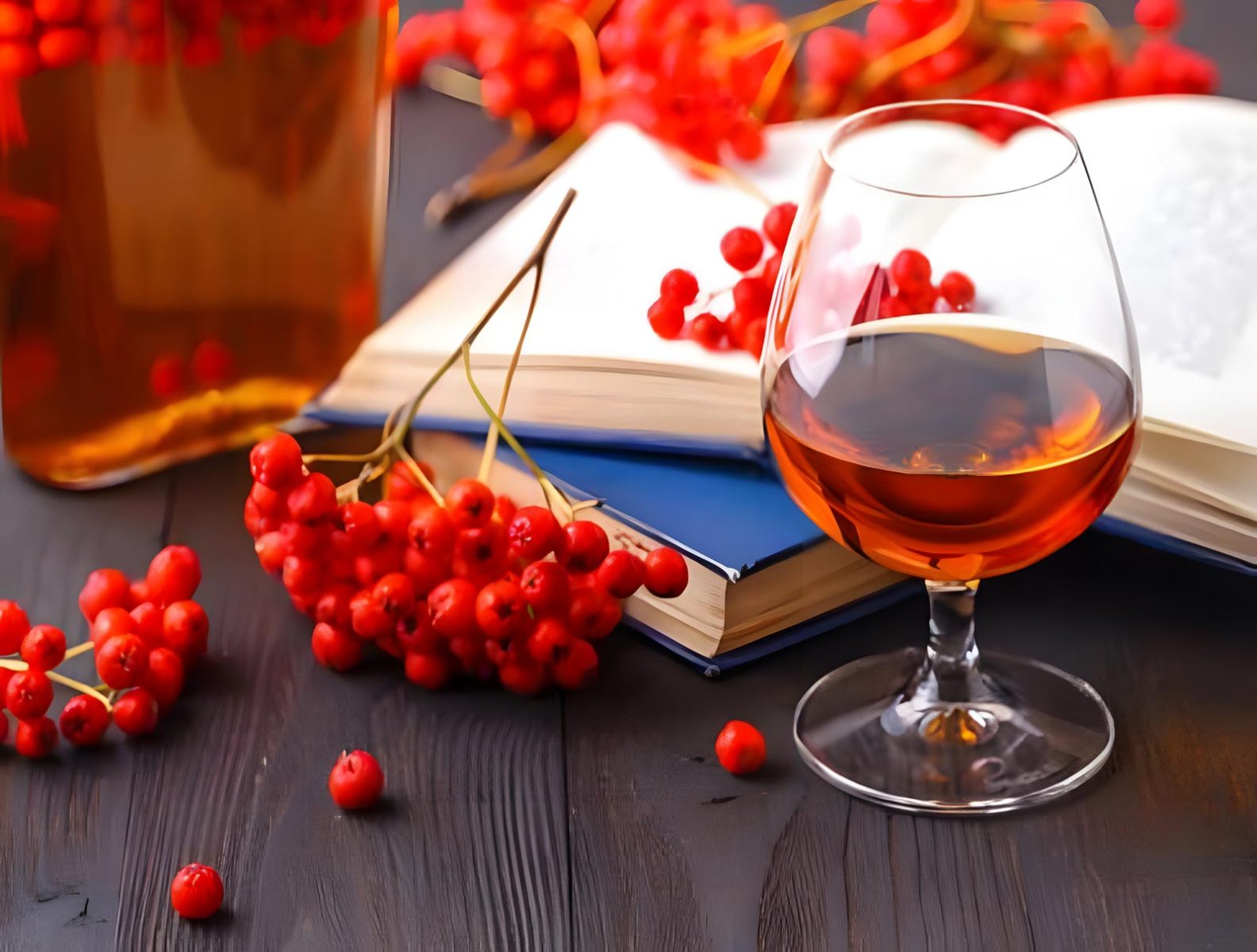 Rowanberries with glass of rowanberry wine